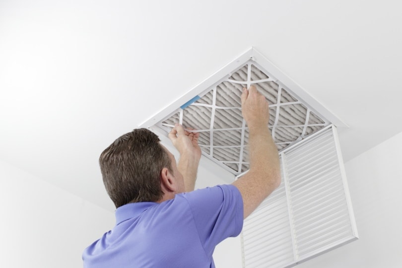 man cleaning airfilter
