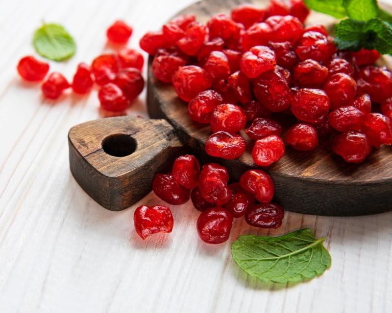 dried cherries in wooden board