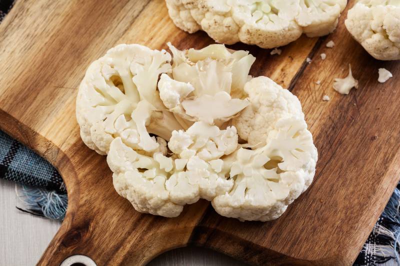 Slices of cauliflower on cutting board