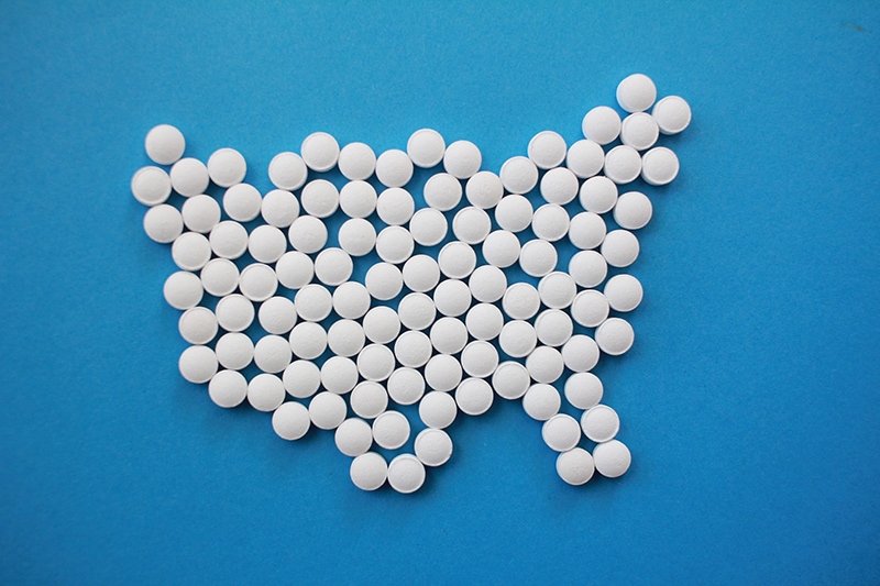 flatlay of white tablets on blue background