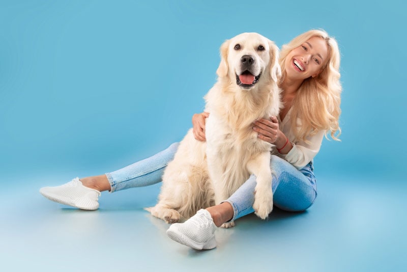 young woman and her dog in a photoshoot