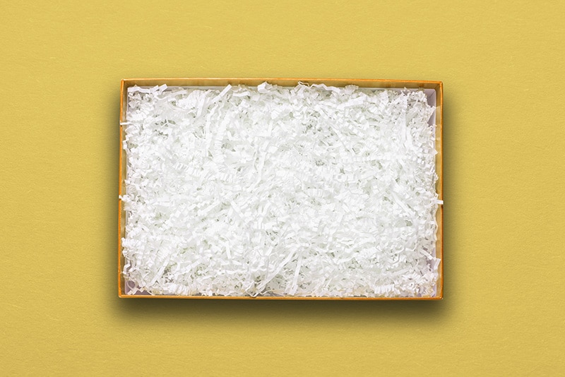 box filled with shredded paper